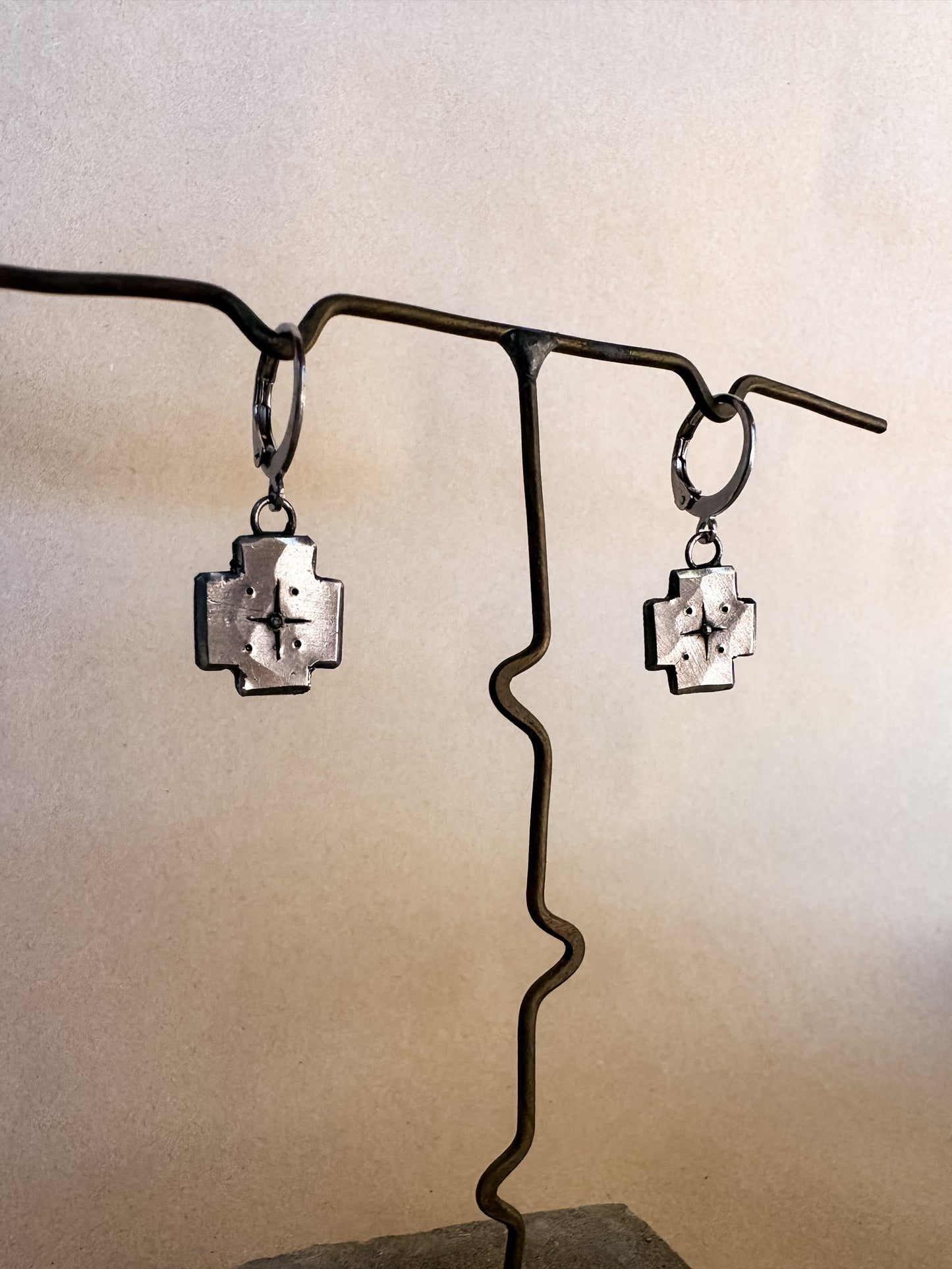 star shield earrings