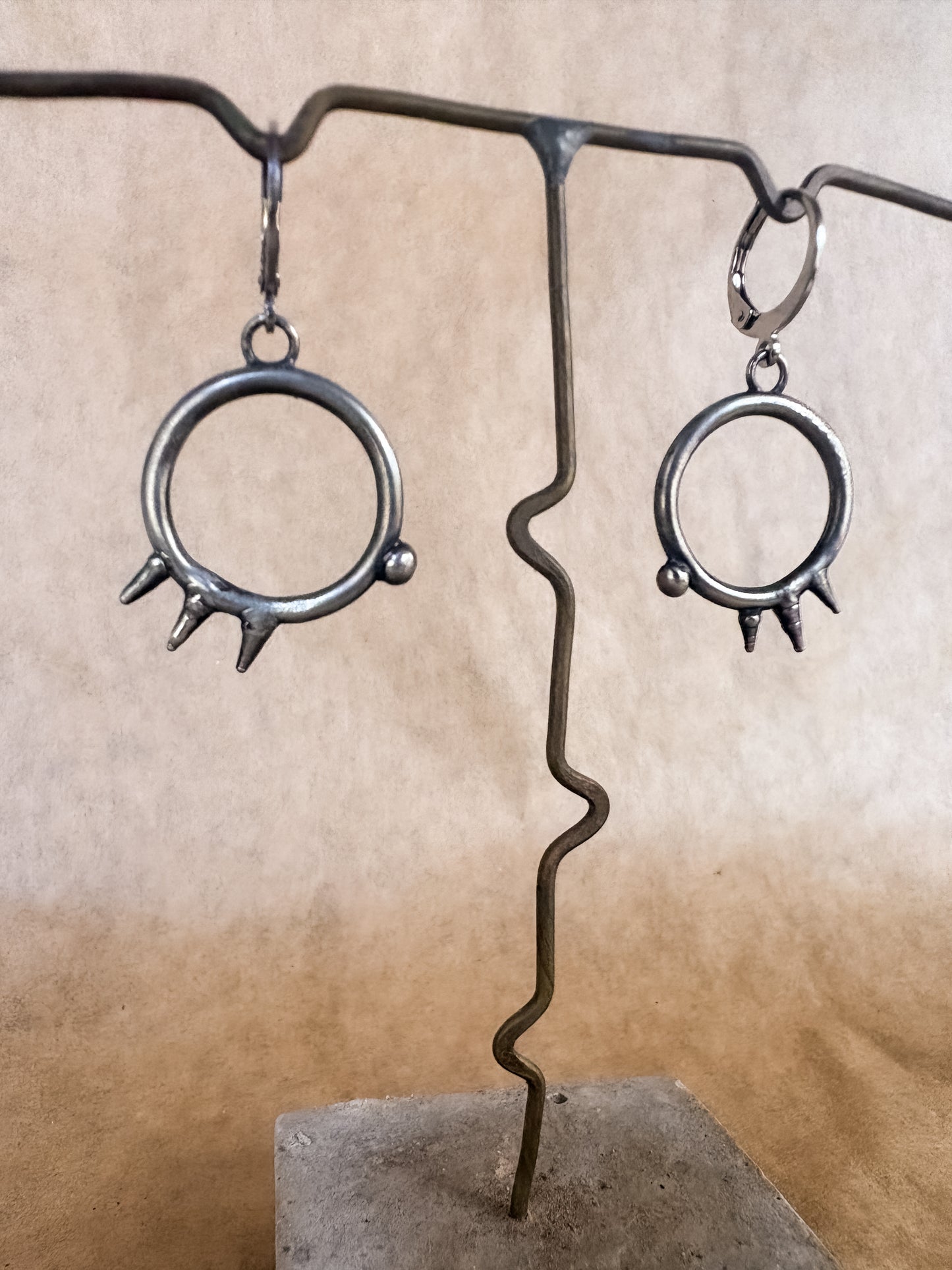 spiked portal earrings