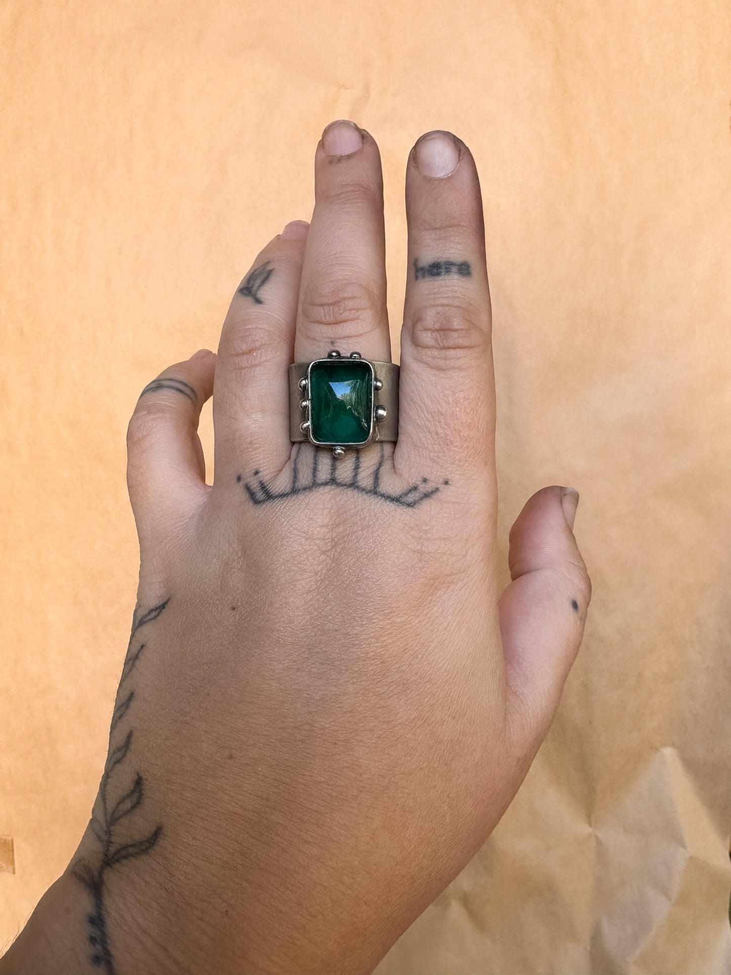 tall green wide band ring