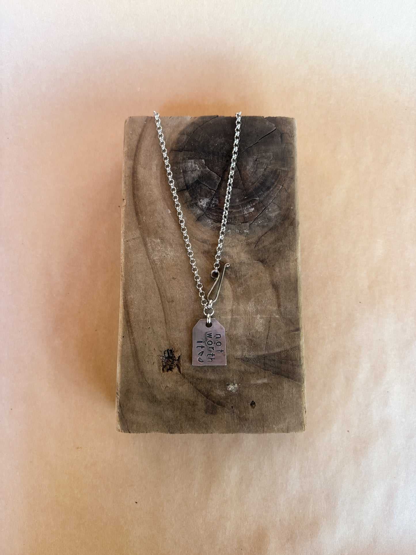 not worth it tag necklace