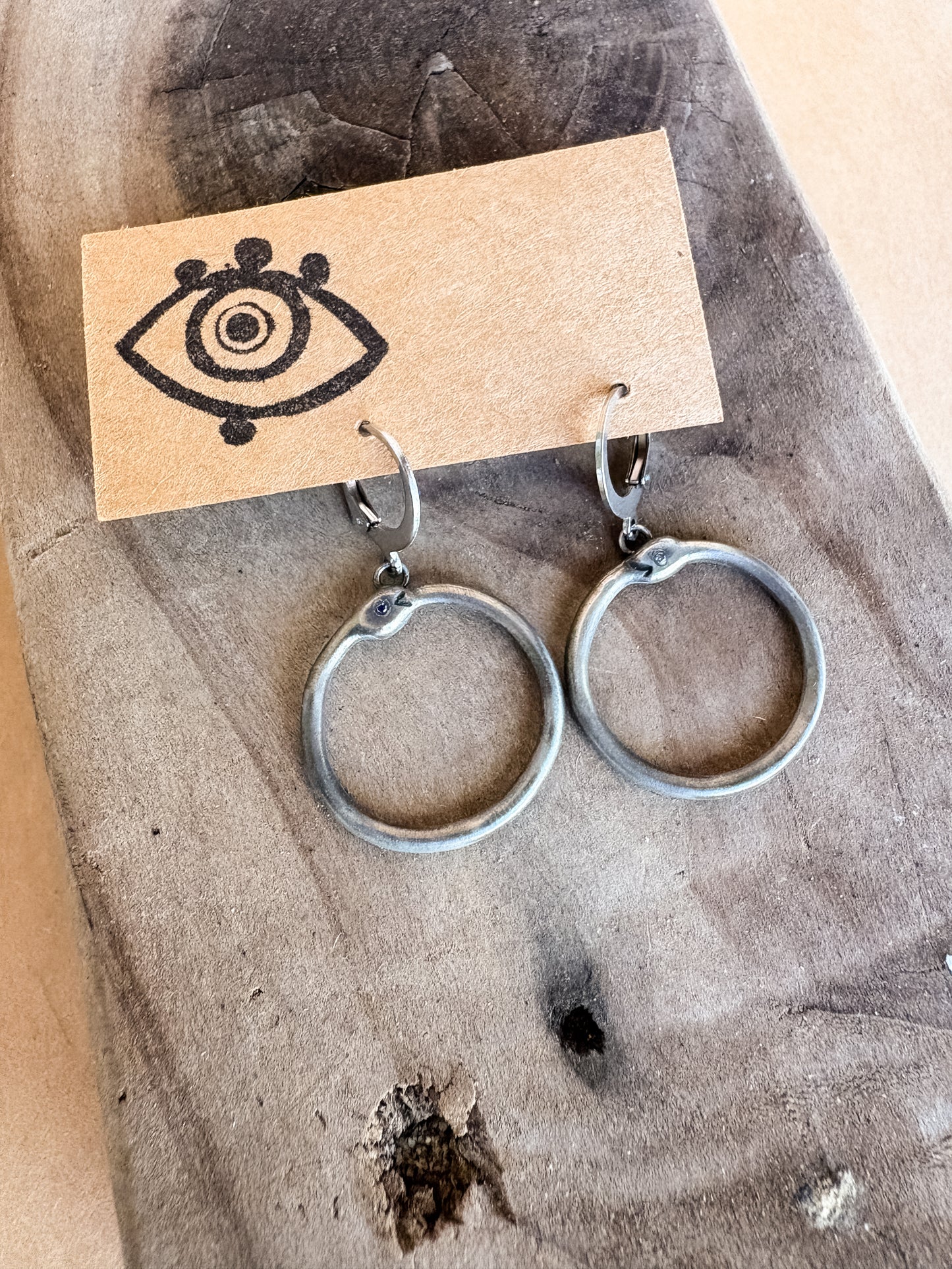 dark blue eyed ouroboros earrings