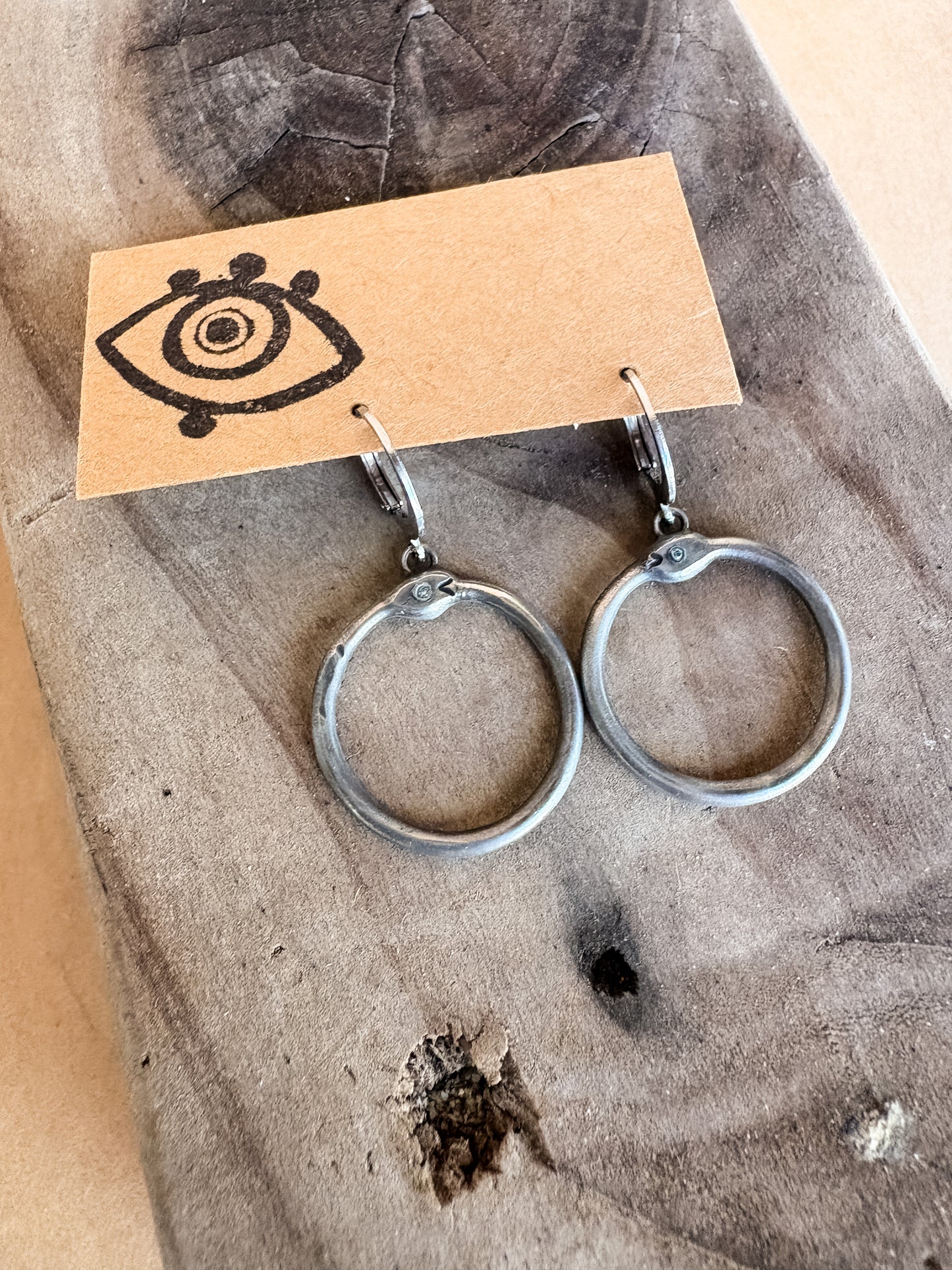 baby blue eyed ouroboros earrings