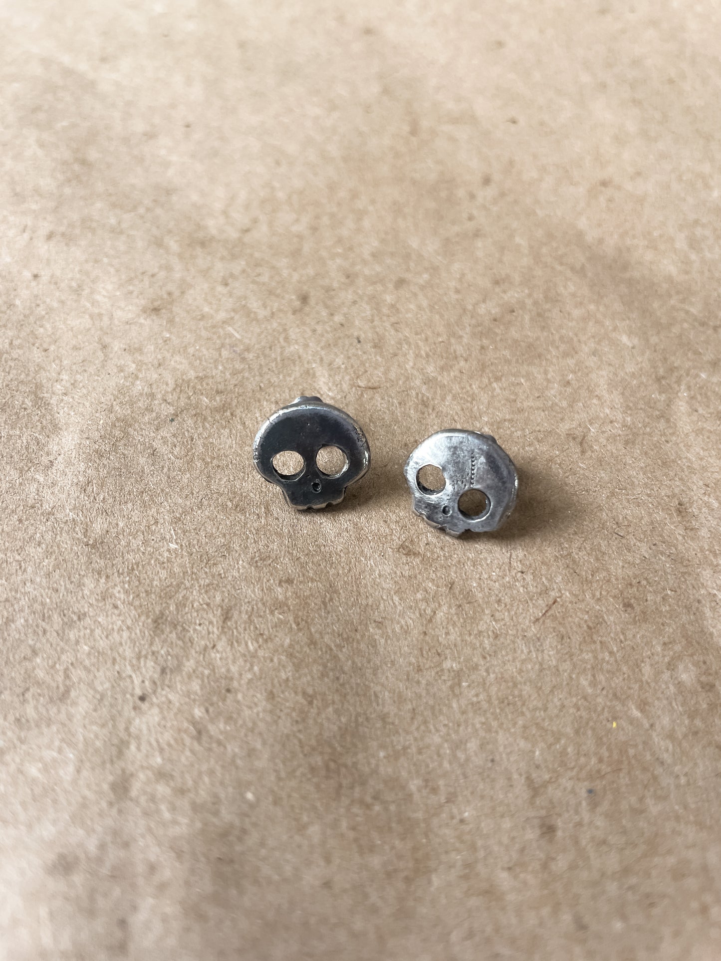 carved skull stud earrings
