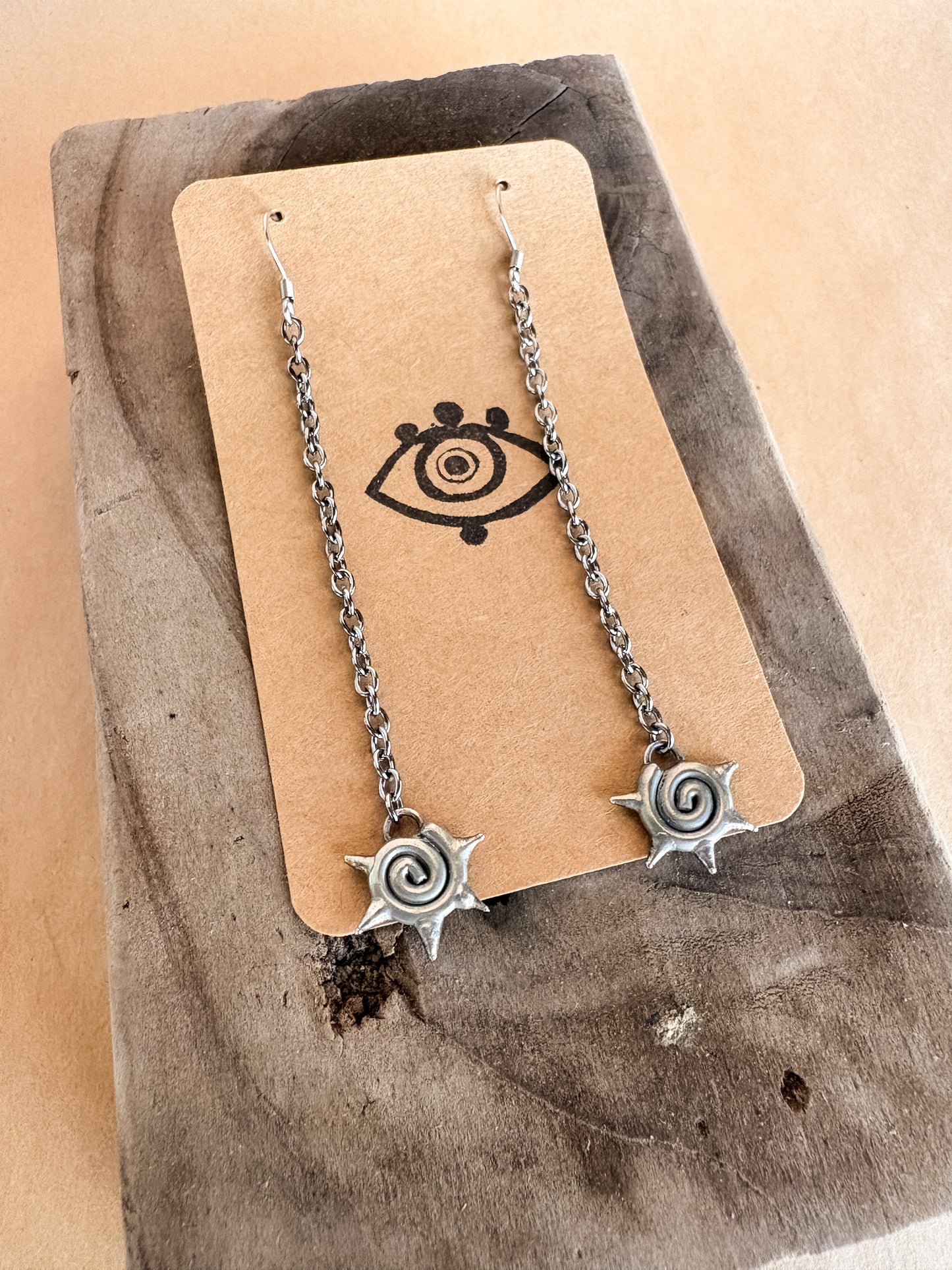 spike swirl long earrings