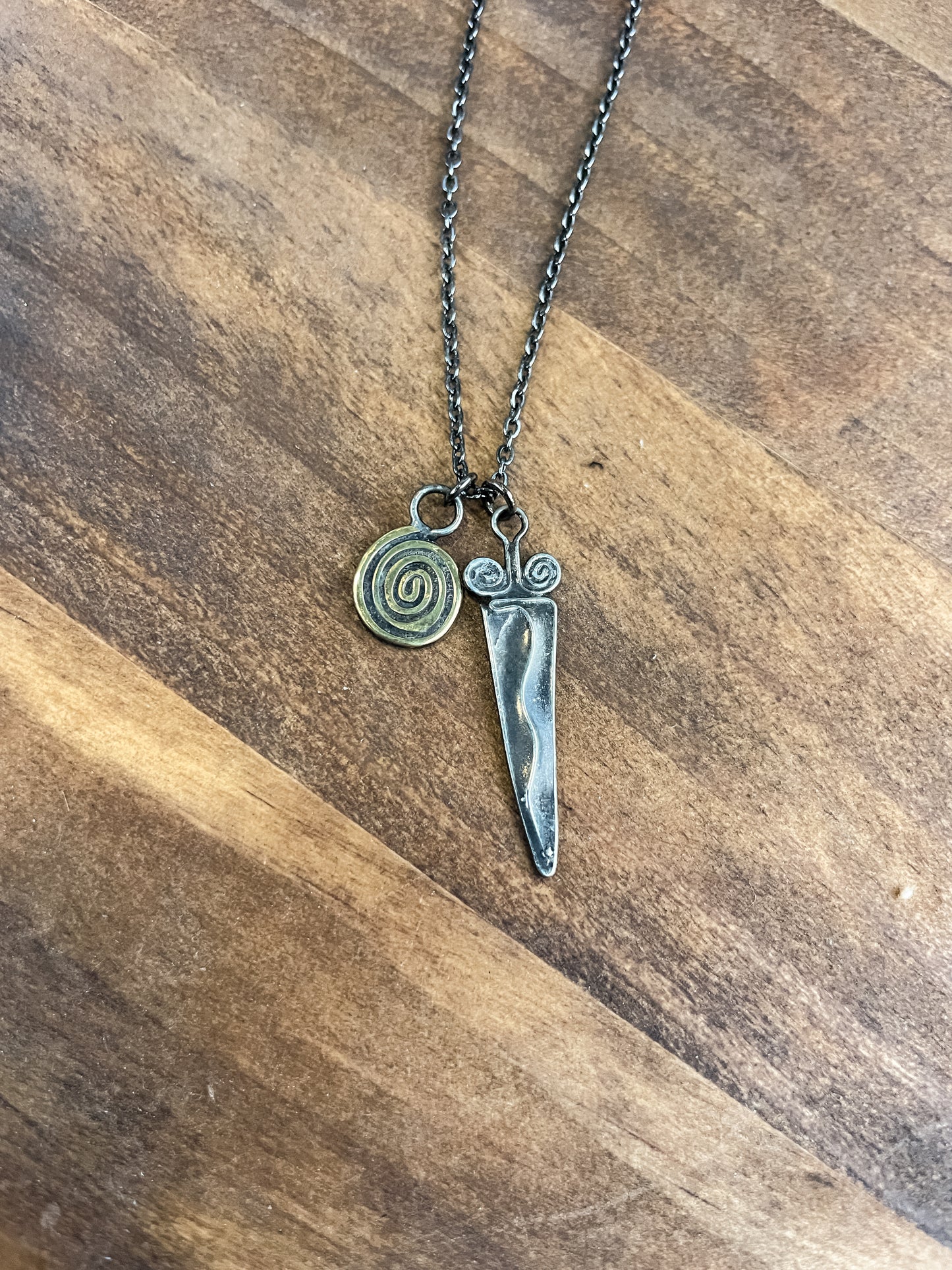 swirl sword necklace