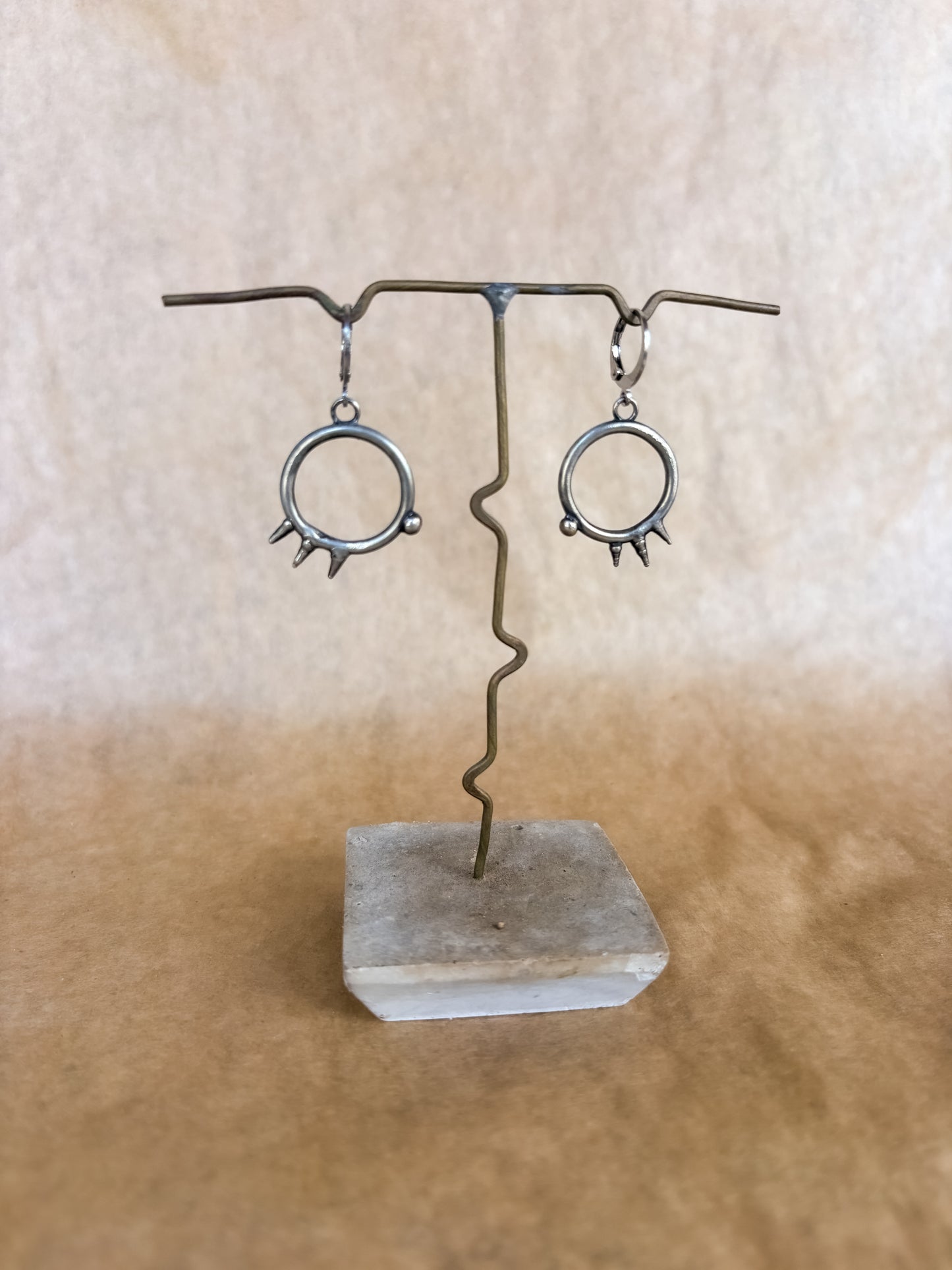 spiked portal earrings