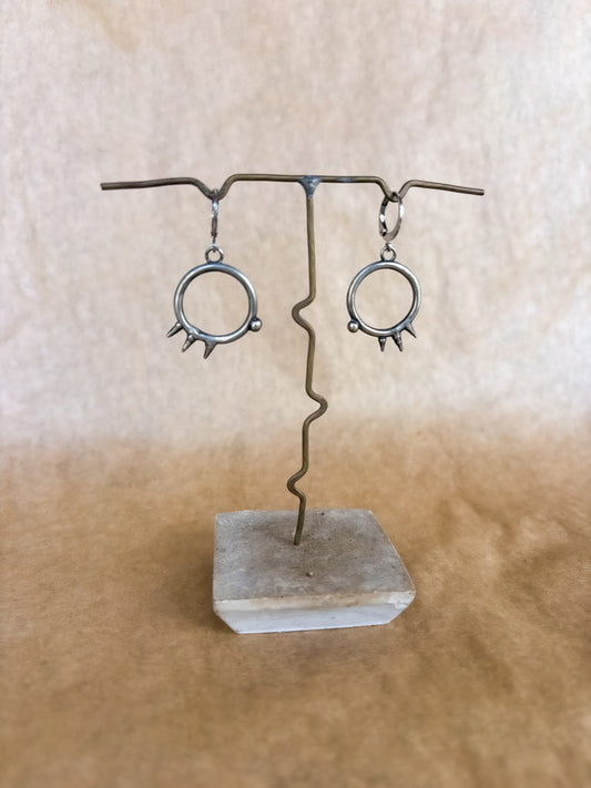 spiked portal earrings