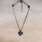 purple studded cross necklace