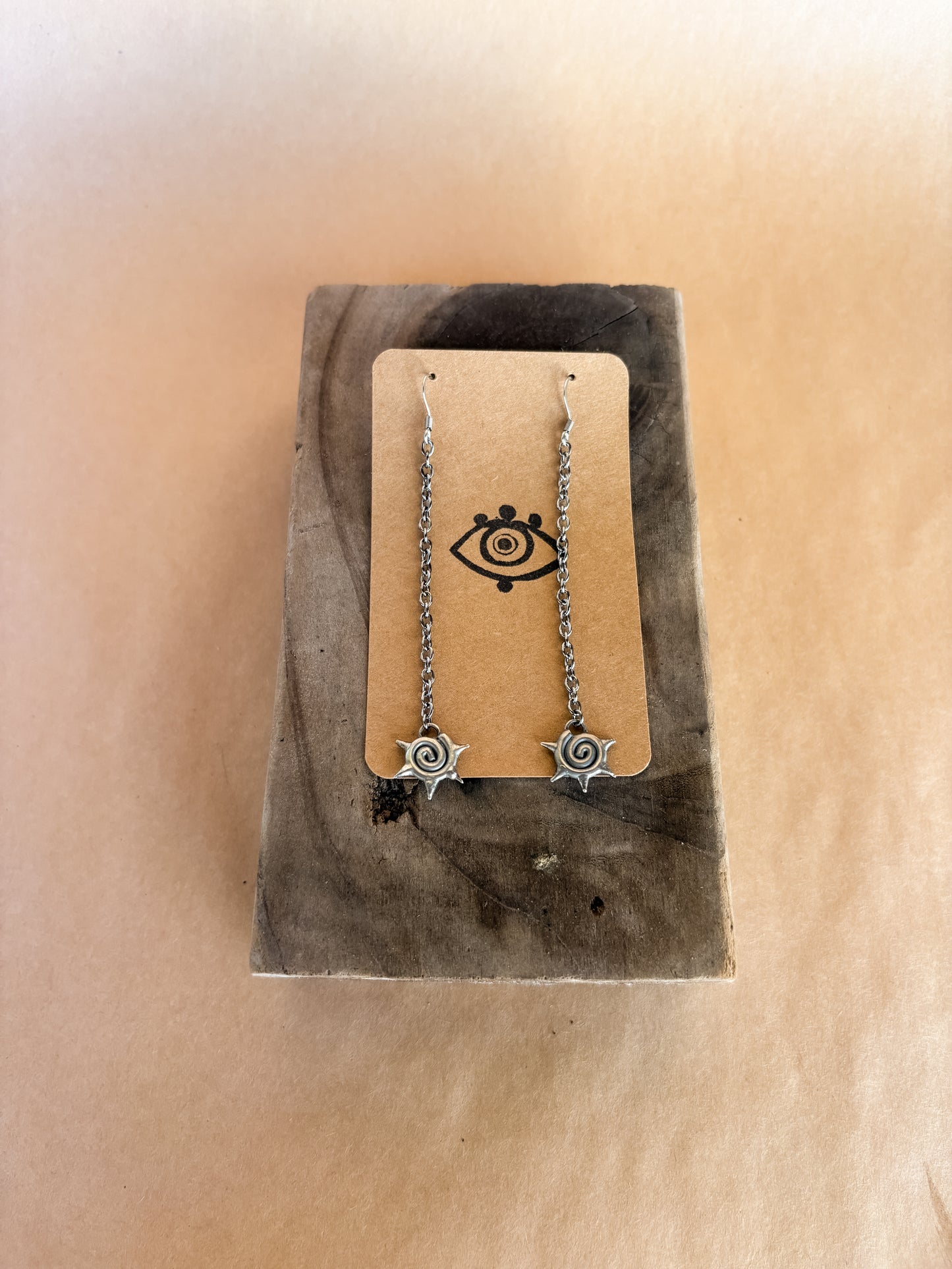spike swirl long earrings