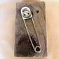 skull star safety pin