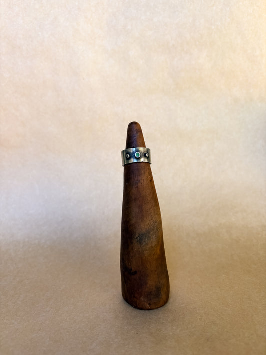 grassy gem wide band ring