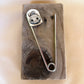 skull star safety pin