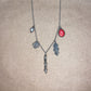 pricked charm necklace