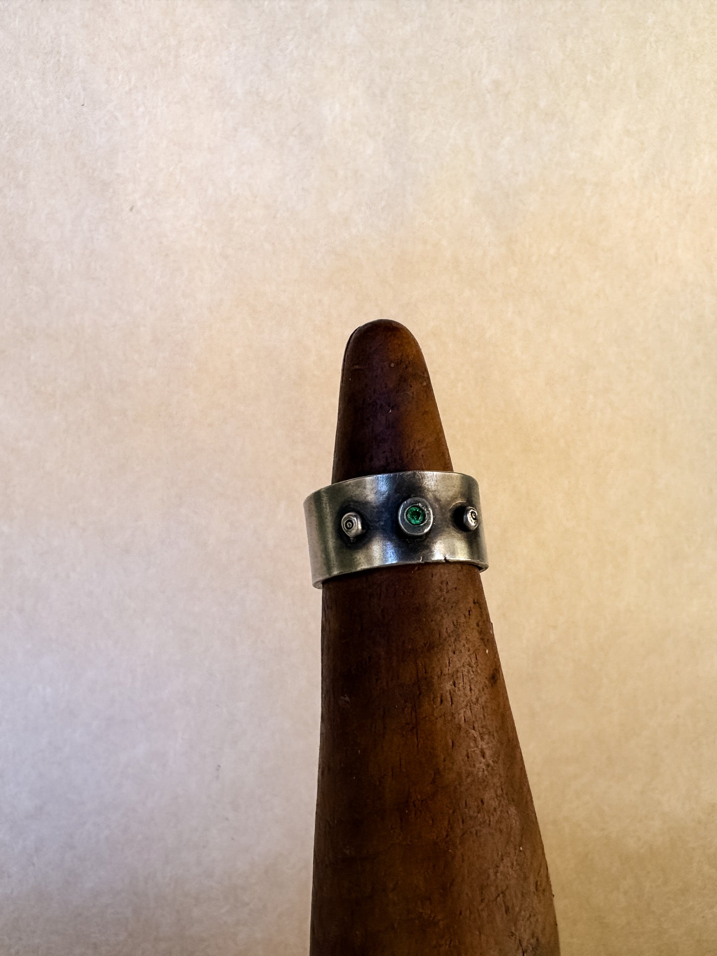 grassy gem wide band ring