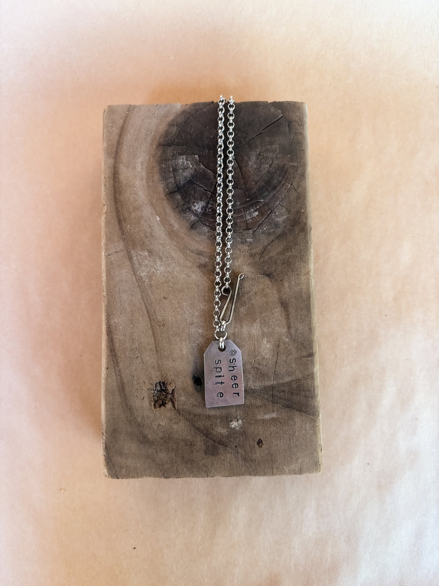 sheer spite star tag necklace