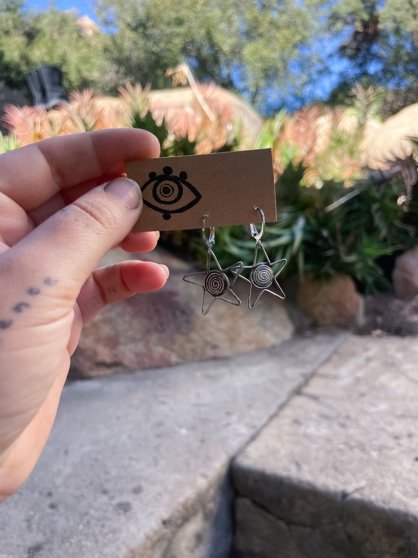 large star swirl earrings