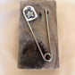 star swirl safety pin