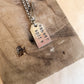 sheer spite star tag necklace
