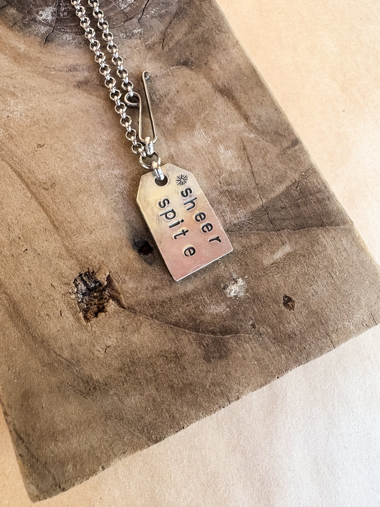 sheer spite star tag necklace