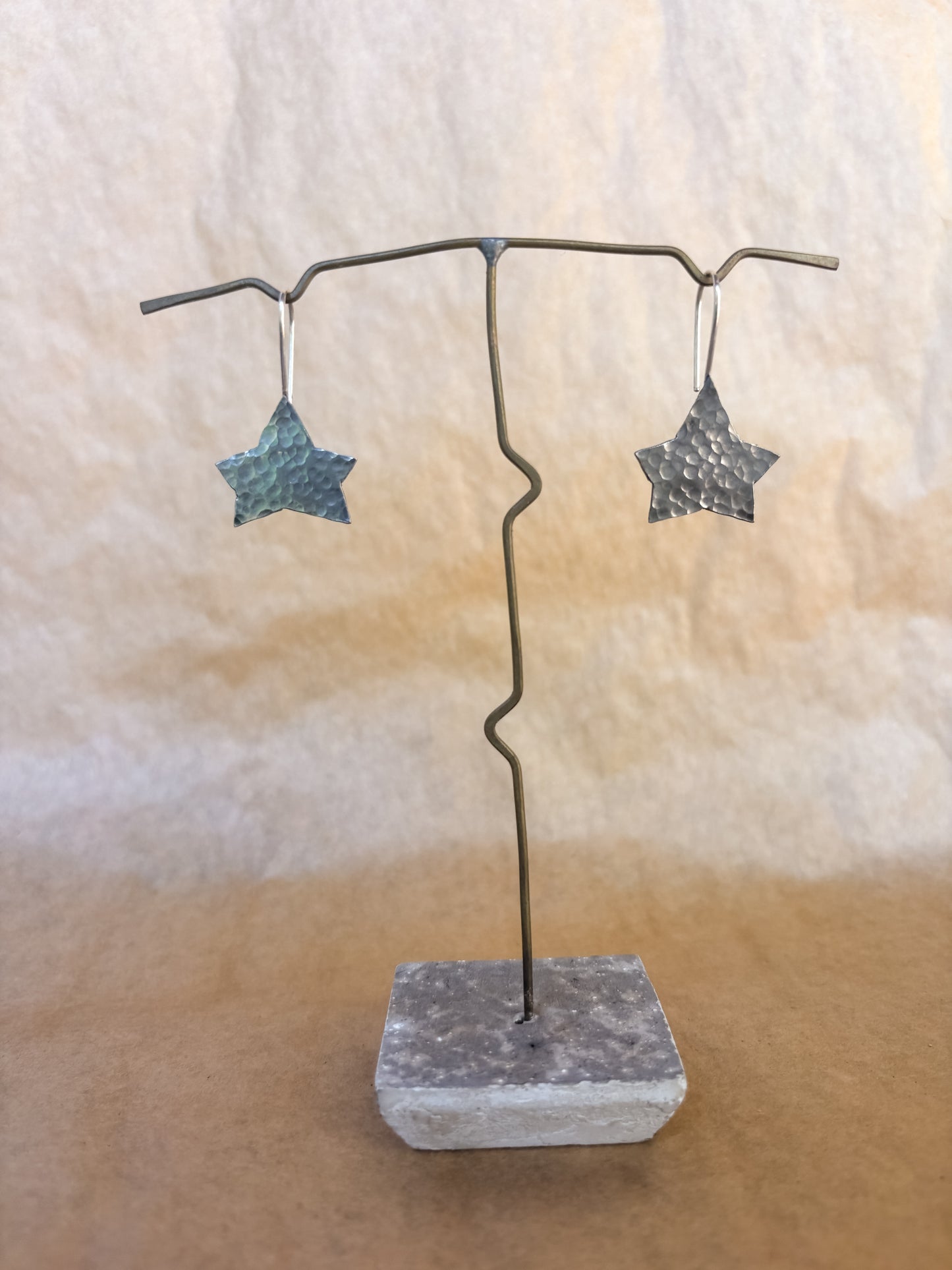 broad star earrings