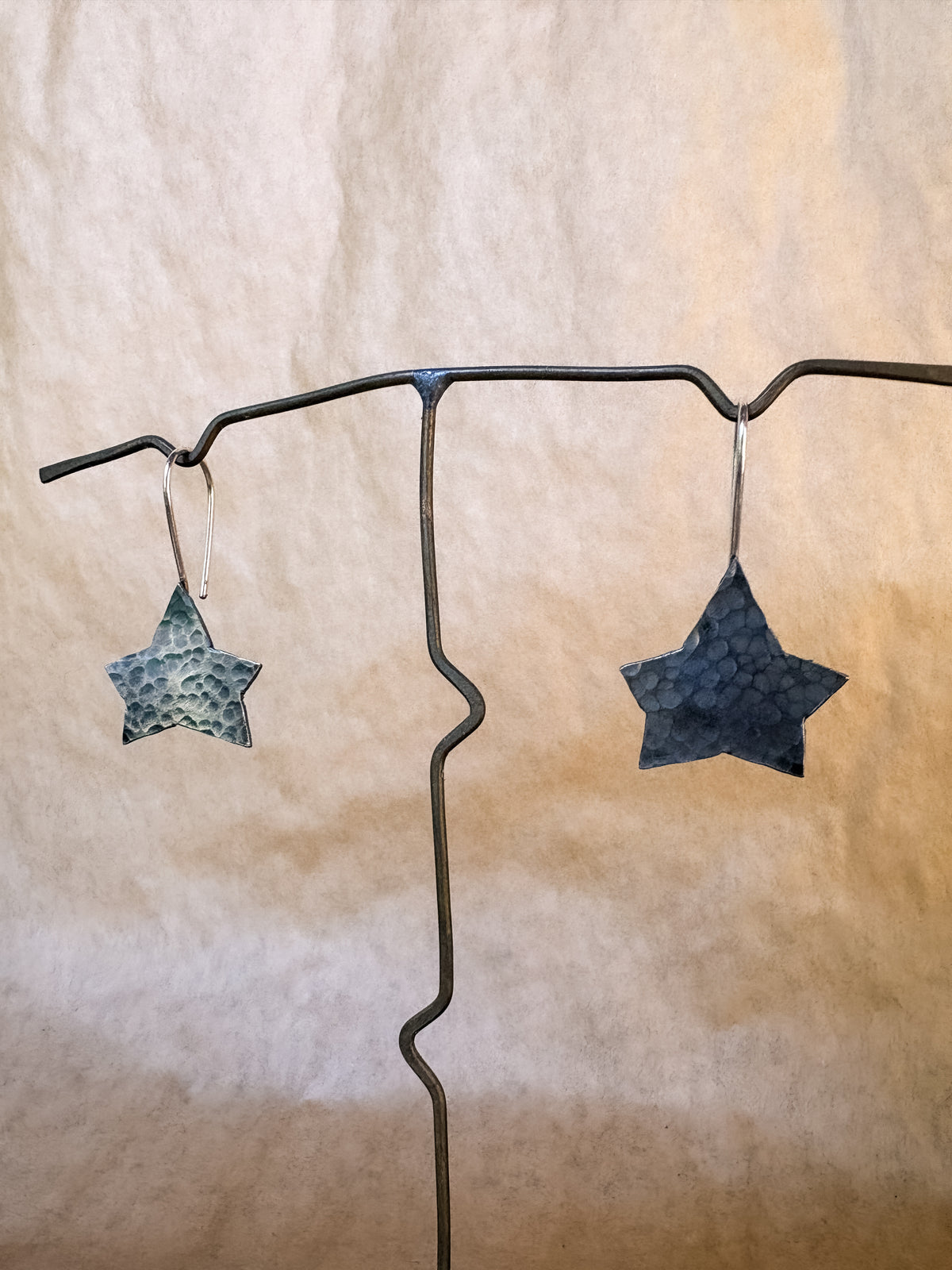broad star earrings